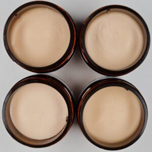 Four jars of My Swim Cream - open and seen from the top